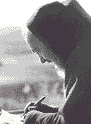 Padre Pio mentre scrive